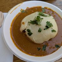 Fufu mit Mafé, ein Hefekloß mit dicker Erdnusssauce und Gemüseeinlage at Kilimanjaro African Food in Dortmund