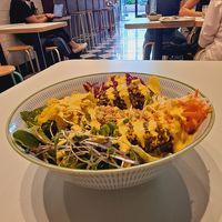 Botanical Salad: greens quinoa, avocado, root veggies, turmeric onions, red sauerkraut, peanut shoots, and saffron aioli dressing!   😋 at Le Botaniste - Penn Plaza in New York City