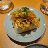 Chili oil and leeks over chilled tofu (okay) at Vegan Izakaya Nowhere in Tokyo