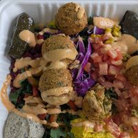 Hummus, falafel, couscous, kale, chickpeas, dolmas, beets,hot peppers, tomatoes plate #Veganuary at Hummus Republic in Oviedo