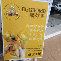 Board outside at entrance at EggBomb Cafe in Johor Bahru
