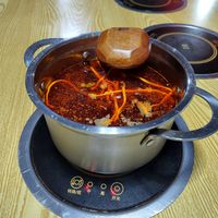 Mildly spicy broth at Chongqing Donghua Temple Vegetarian Hot Pot in Chongqing