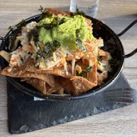 Niet echt enthousiast  De oven stond waarschijnlijk te hoog waardoor de nacho’s nogal hard en droog waren.   at Oishii in Tenerife