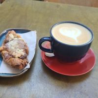Yummy almond and raspberry vegan croissant and oat cappuccino at One Shot Coffee in North West London