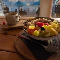 Porridge with Granola and fruits at Huckleberry's  in Bocholt