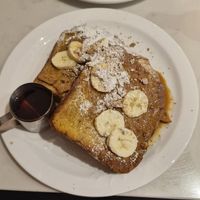Veganuary special: griddled vegan french toast in our homemade vanilla bouche batter. Topped with Biscoff sauce, crumb, bananas, and Canadian maple syrup at Moose Coffee in Manchester