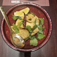 Tempura Fried Coconut Meat:
Coconut Meat, Lime, Chilli, Mint, Coriander, Kaffir Lime Leaves, Roasted Rice at Vegan Pranakhon in Bangkok