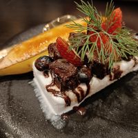 Coconut ice cream with banana brulee at Vegan Pranakhon in Bangkok