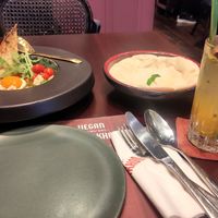 Vegan Shakshuka with pita bread and Sparkling Passion Fruit Drink at Vegan Pranakhon in Bangkok