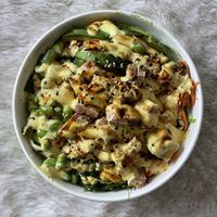 Bowl with mango sauce  at Yoko Sushi - Takeout & Delivery in Hamburg