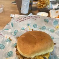BBQ mushroom bacon burger in the foreground, with shakes and fries with spice dust in the background.  at PLNT Burger in Brookline