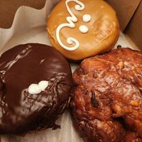 Portland cream, maple cream and apple fritter at Voodoo Doughnut in Seattle