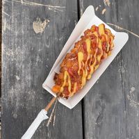 vegan corndog with mustard, ketchup, and sugar  at Yonggung Rest Area - 용궁휴게소 in Busan