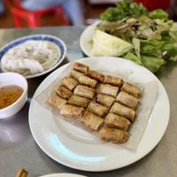 Fried spring rolls served with fresh green and noodles to make your own wraps  at Ha Pham Vietnamese Restaurant in Pakse