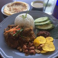 Nadi Lemak with soy beef rending, and roti cannai  at Malaysian Chapter in Belconnen