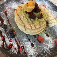 Vegan pancakes with fruit and pistachio topping  at Boho Brunch Café in Dusseldorf