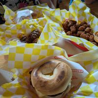 Fully loaded bagel and tots at Shahar in Louisville