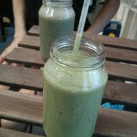 Green smoothie, and Superfoods smoothie in the background at 48 Degrees Raw Cafe in Brisbane