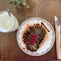 Avocado toast (without egg), sourdough bread, lime, pomegranate, hemp/poppy seeds, and balsamic cream. CHF 11.- (vegan)   at Apotheca Cafe - Brunch - Bar in Neuchatel