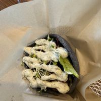 Falafel on house made hemp charcoal pita with tzatziki sauce. at Yaam in Yokosuka