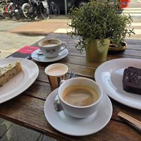 Banana cake, chocolate cake, americanos at Chimney Cake Bakery & Cafe  in Amsterdam