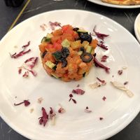 Panzanella (bred, cherry tomatoes, red onions, cucumber) with some black olives, well presented good sized serve, taste great at Alla Bracioleria Vaticano in Rome