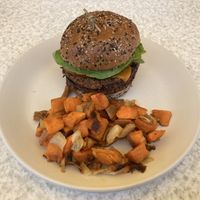 Their vegan double cheese burger with sweet potato hash  at True Food Kitchen - Fashion Valley Mall in San Diego