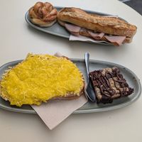 Croque Monsieur, browkie, cinnamon roll & sandwich with ham, mayo, pickle at Land & Monkeys - Les Halles in Paris