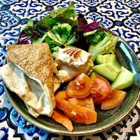 Hummus, salad and bread at Feta Restaurant in Dubai