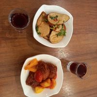 Side dishes and free plum juice at Water Drop Teahouse - 壽山人文滴水坊 素食餐廳 in Kaohsiung