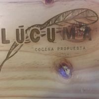 The beautiful branding on the woodsy new table and chair sets. at Lucuma in Guadalajara