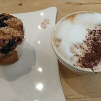 soy cappuccino and blueberry muffin at Le Pain Quotidien - Varenne in Paris