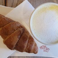 Vegan croissant and golden latte with oat milk at Le Pain Quotidien - Victor Hugo in Paris
