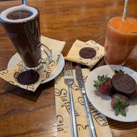 Hot chocolate, fruit smoothie and chocolate dipped strawberries. at Slattery in Manchester