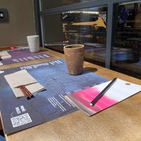 The table towards the window, instructions for having your ramen, card and pencil to make your wishes  at Yume Ramen in Rimini