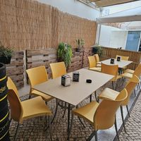 Outdoor seating at the back. at Guaro's Burger Bar in Aveiro