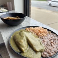 Tamales, fries behind, enchiladas with onions at the back.  at Abuelita Coco in Oak Lawn