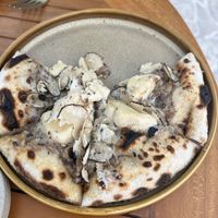 Truffle pizza  at TAAMA Restaurant in Dubai