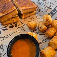 Vegan grilled cheese w/ both cheeses + burger patty, tomato soup and tator tots at I Heart Mac & Cheese in Sacramento