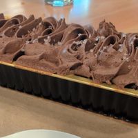 Ready to eat chocolate cake lightly topped with salt at The Corner Counter in Red Hook