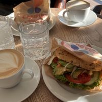 Oat cappuccinos and avocado-tomato bagels.  at Campus Suite  in Hamburg
