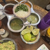 4 salsas, onions, cilantro and lime as toppings for tacos   at Tacos Sonorita Olas Atlas in Puerto Vallarta