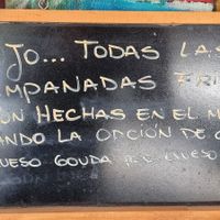 Outside menu stating vegan cheese option at Delicias Express in Valparaiso