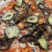 Veg pizza made vegan by swapping to vegan cheese for an extra $4  at The Beach House  in Trinity Beach