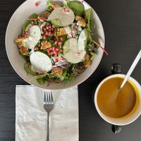 Pumpkin cream soup 
Salad spinach “chickn” pomegranate creamy dressing  at Paradoja Plantbased in San Juan
