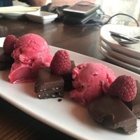 Chocolate fudge dessert with raspberry sorbet. Delish! at Blue Sushi Sake Grill in Fort Worth