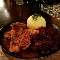 Bodhi Pfanderl: crunchy crust soysteak in dark beer sauce, whirh apple red cabbage and a potato dumpling, served in a pan at Bodhi in Munich