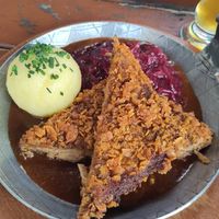 Crispy steak with potato dumpling and red cabbage at Bodhi in Munich