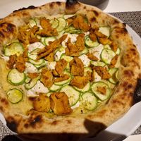 Pizza bianca con mozzarella di mandorla e straccetti vegetali at Il Buco Ristorante Pizzeria in Riccione