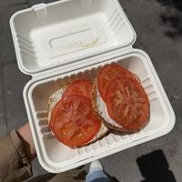 Sesame with vegan cream cheese and tomato  at Apollo Bagels in New York City